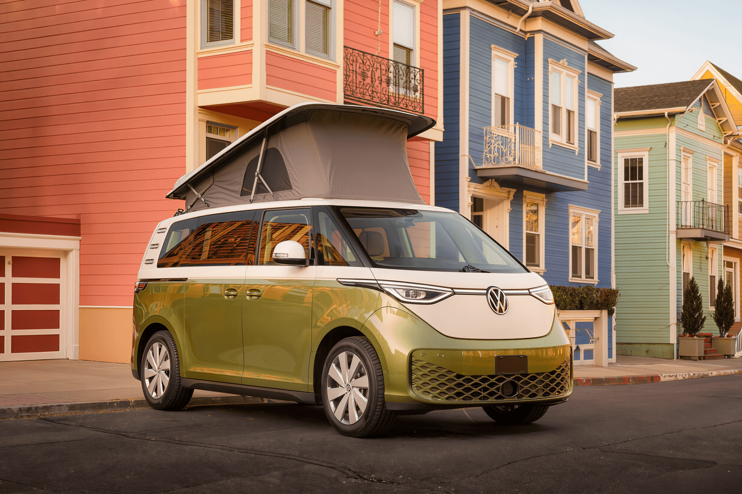 Two-tone green and white electric camper van on an Asheville street